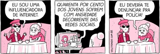 Tirinha “Anésia” em três quadros, em tons de rosa. Quadro 1: uma jovem de óculos escuros e boina, sentada à mesa com a idosa Anésia, diz: “EU SOU UMA INFLUENCIADORA DE INTERNET.” Quadro 2: uma televisão exibe: “QUARENTA POR CENTO DOS JOVENS SOFREM COM ANSIEDADE DECORRENTE DAS REDES SOCIAIS.” Quadro 3: Anésia, de cara fechada, diz à jovem: “EU DEVERIA TE DENUNCIAR PRA POLÍCIA!” Assinatura lateral: willtirando.com.br.